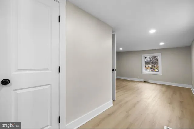 a bathroom with a double vanity sink toilet and a mirror