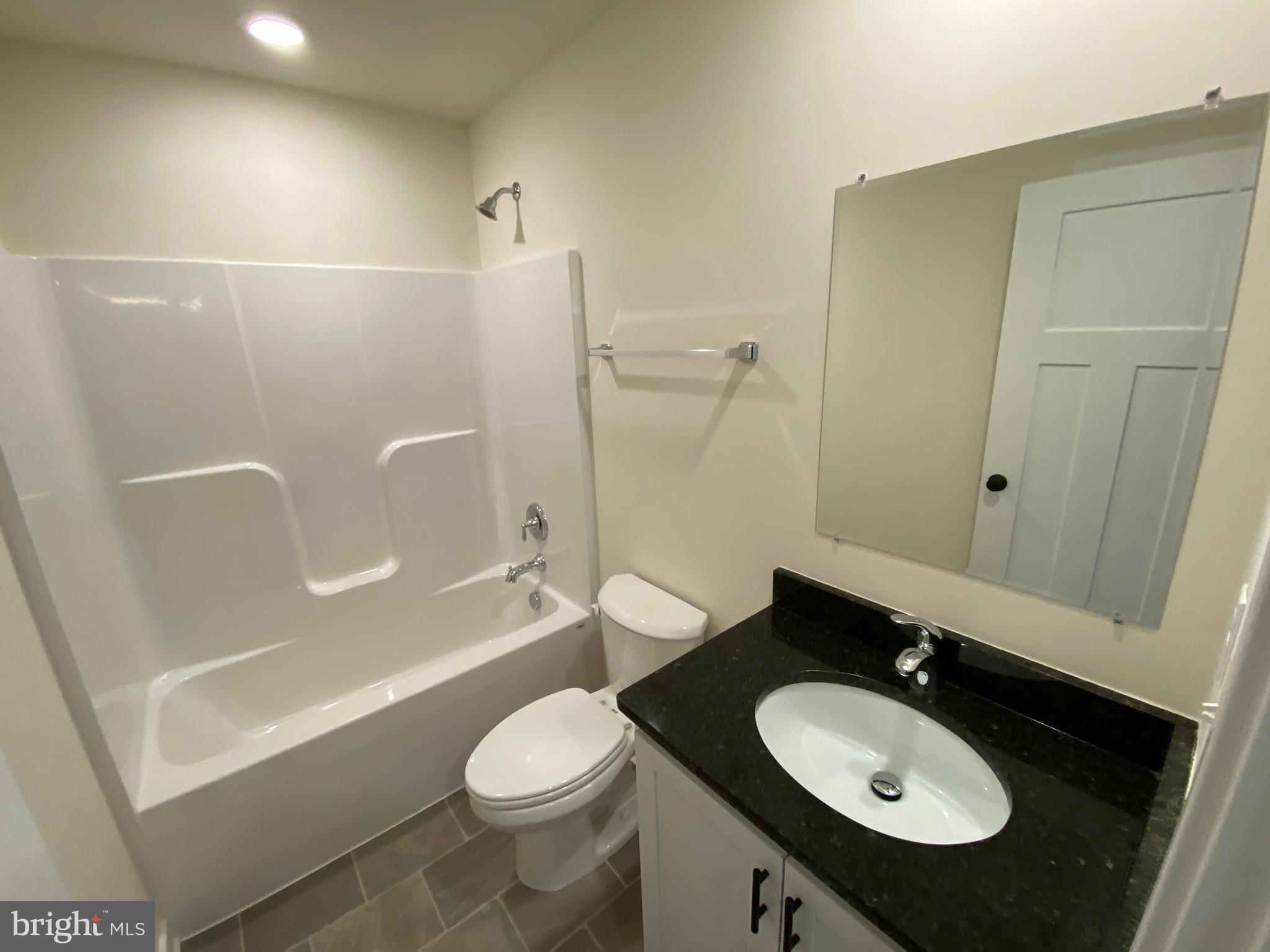 170 Forest Grove Road Colonial Beach, VA 22443 - Photo 25 of 34 a bathroom with a sink a toilet and shower