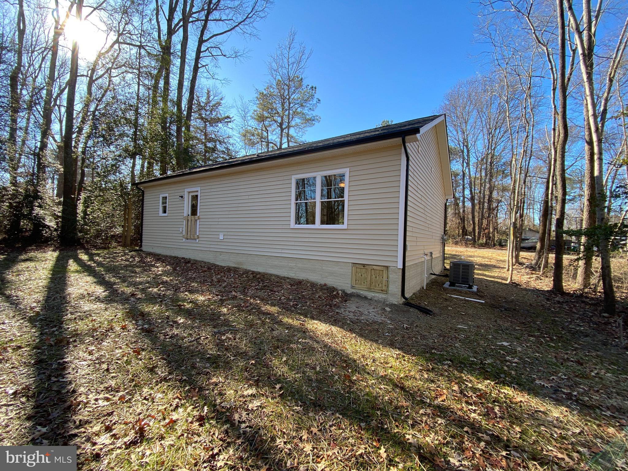 170 Forest Grove Road Colonial Beach, VA 22443 - Photo 7 of 34 a view of a house with a yard