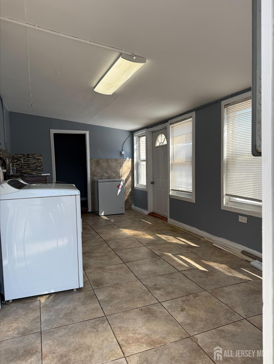 1211 Stelton Road Piscataway, NJ 08854 - Photo 16 of 16 a view of a livingroom with furniture and a window