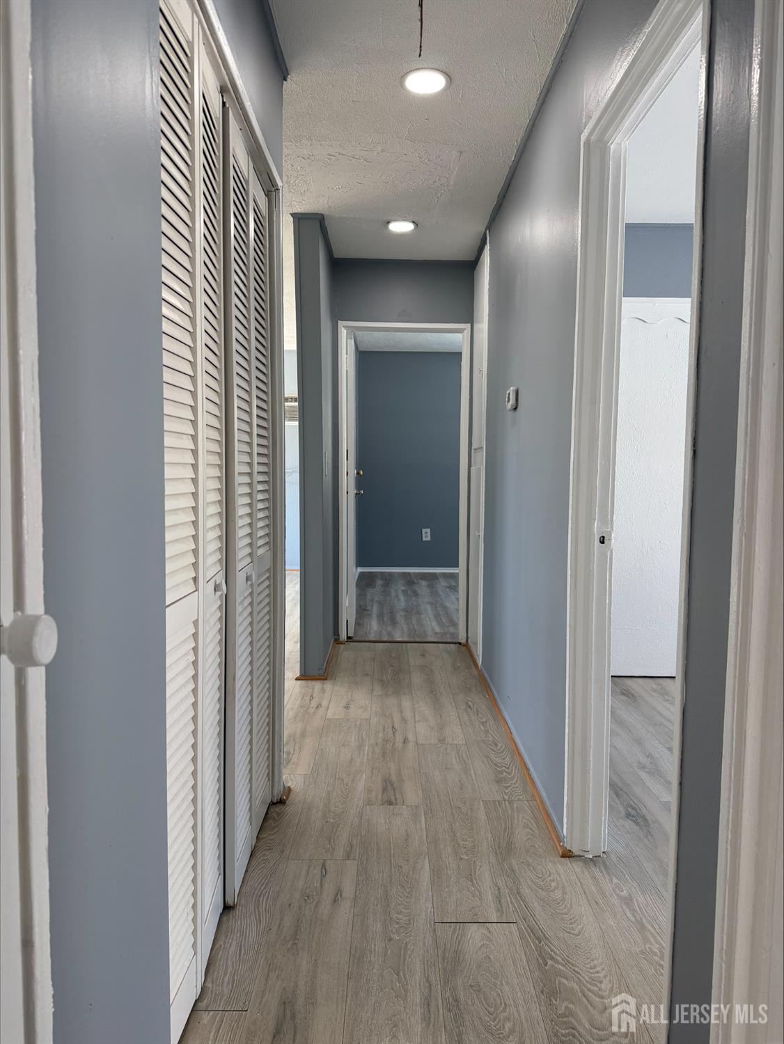 1211 Stelton Road Piscataway, NJ 08854 - Photo 7 of 16 a view of a hallway with wooden floor