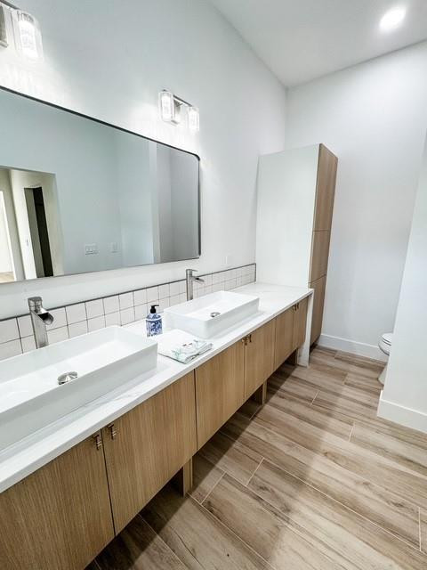 1445 Southeast 23rd Street Okeechobee, FL 34974 - Photo 7 of 11 a bathroom with double vanity sinks and a large mirror