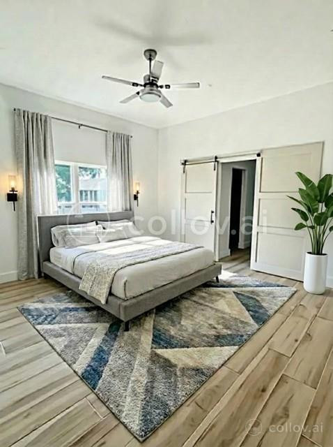 1445 Southeast 23rd Street Okeechobee, FL 34974 - Photo 9 of 11 a bedroom with a large bed and a chandelier