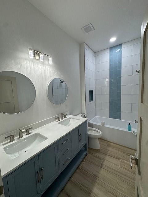 1445 Southeast 23rd Street Okeechobee, FL 34974 - Photo 10 of 11 a bathroom with a double vanity sink toilet mirror and bathtub