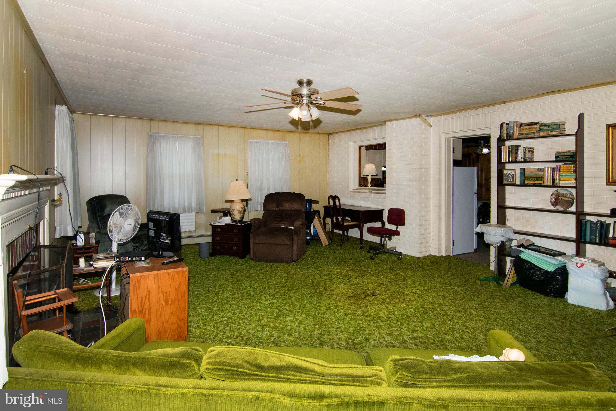 266 Passaic Avenue Thorofare, NJ 08086 - Photo 19 of 53 a living room with furniture and a gym equipment