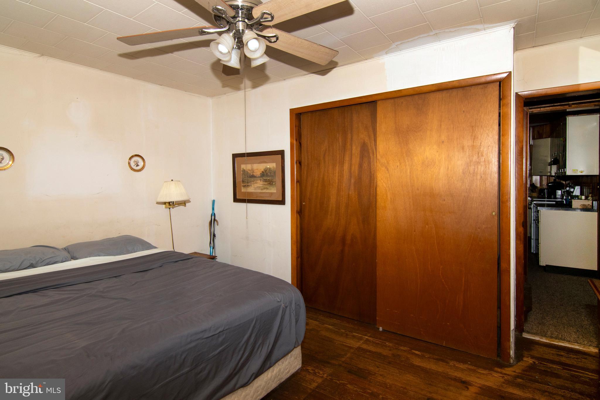 266 Passaic Avenue Thorofare, NJ 08086 - Photo 28 of 53 a bedroom with a bed and a chandelier