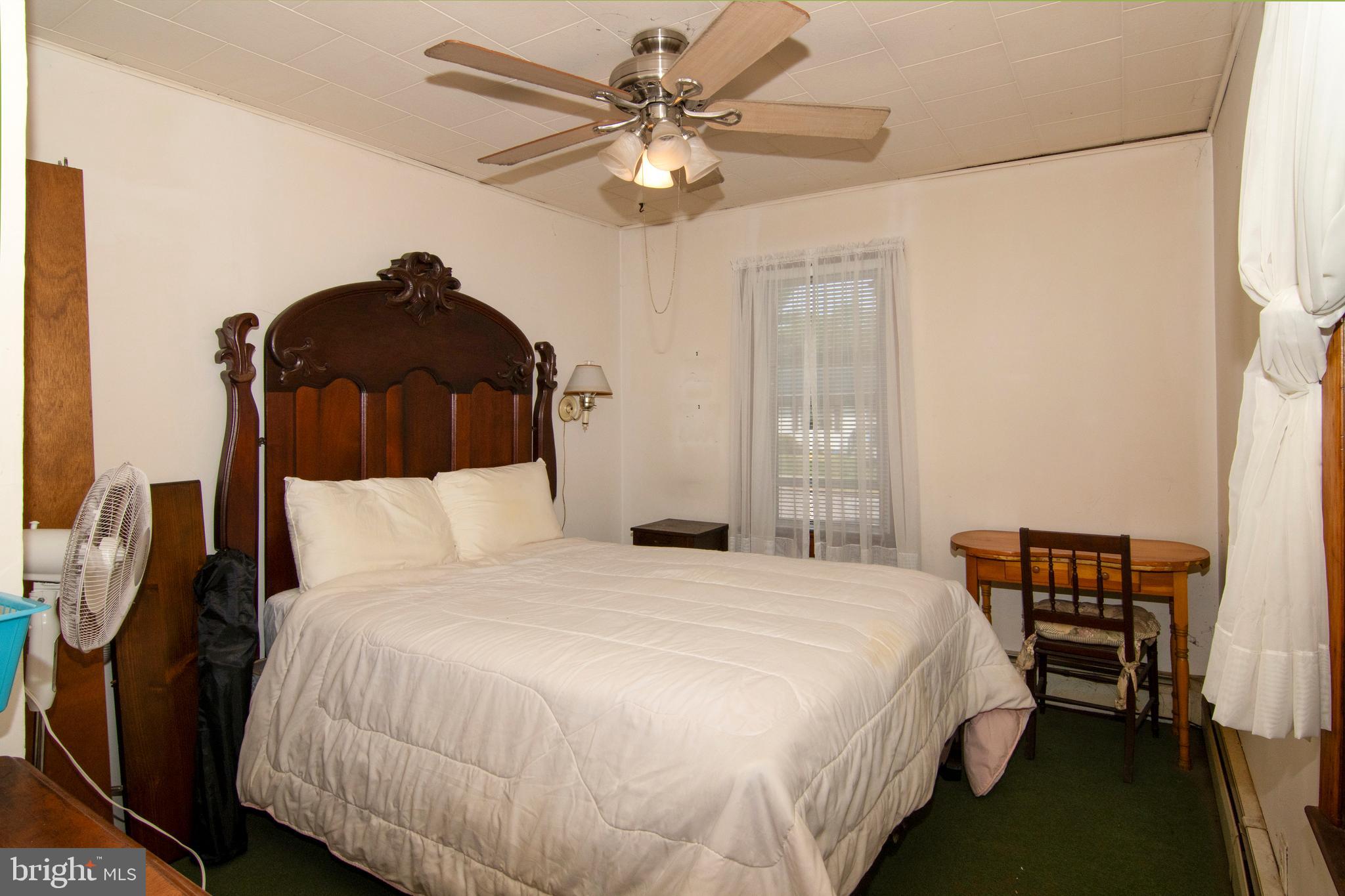 266 Passaic Avenue Thorofare, NJ 08086 - Photo 30 of 53 a bedroom with a bed and a chandelier