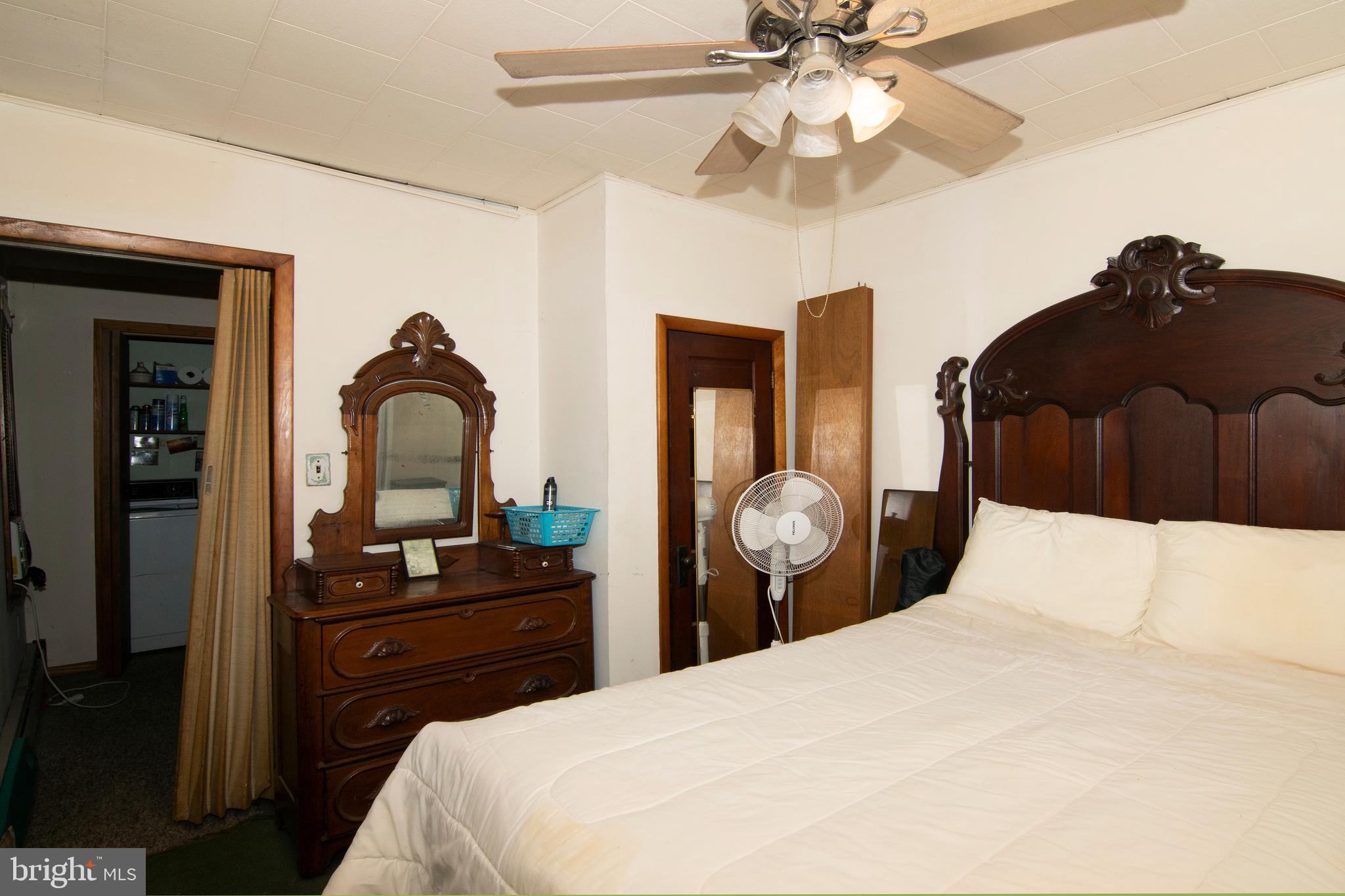 266 Passaic Avenue Thorofare, NJ 08086 - Photo 31 of 53 a bedroom with a bed and a chandelier