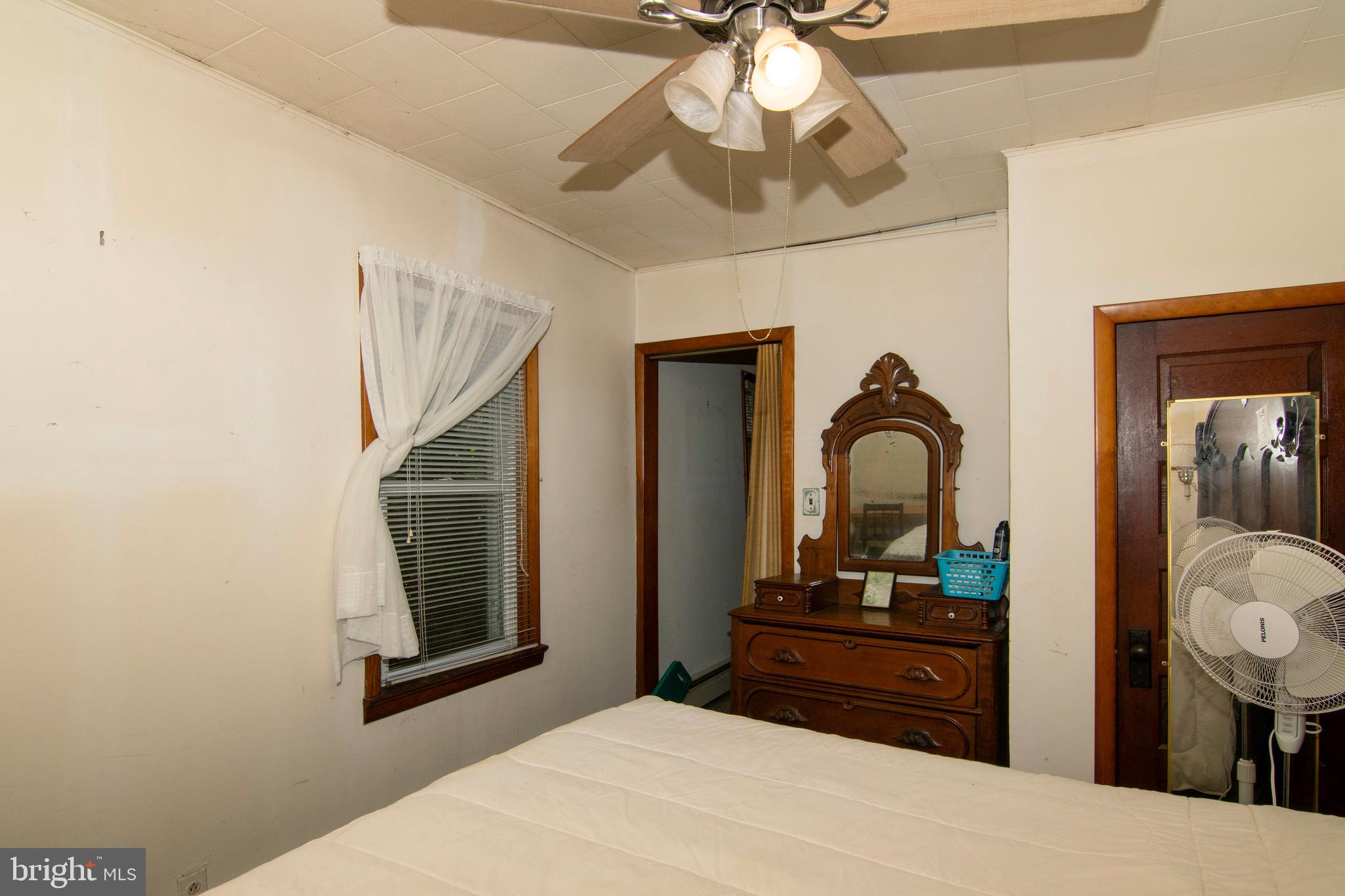 266 Passaic Avenue Thorofare, NJ 08086 - Photo 32 of 53 a bedroom with a bed and a dresser