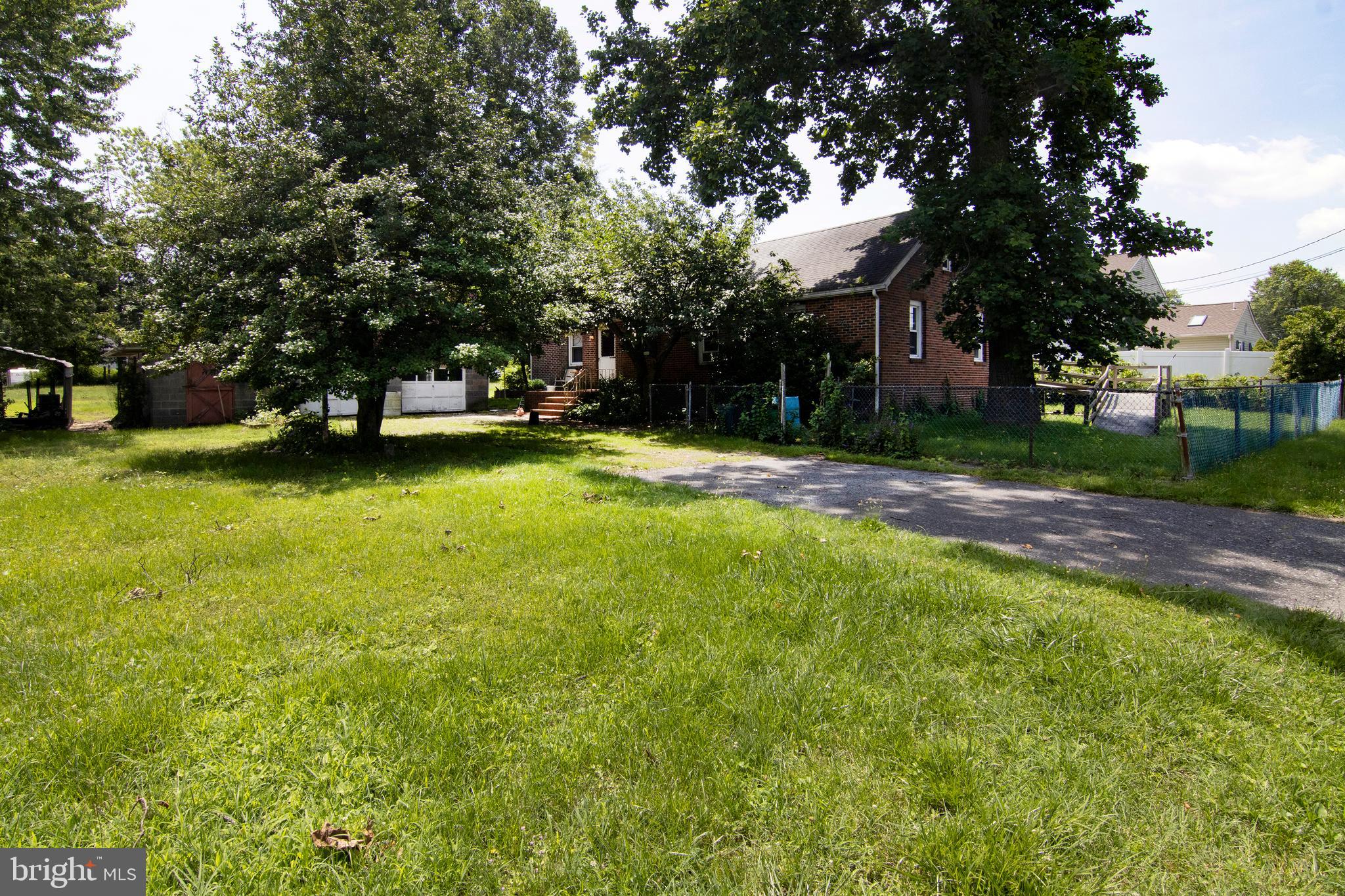 266 Passaic Avenue Thorofare, NJ 08086 - Photo 38 of 53 a view of a swimming pool and trees in the background