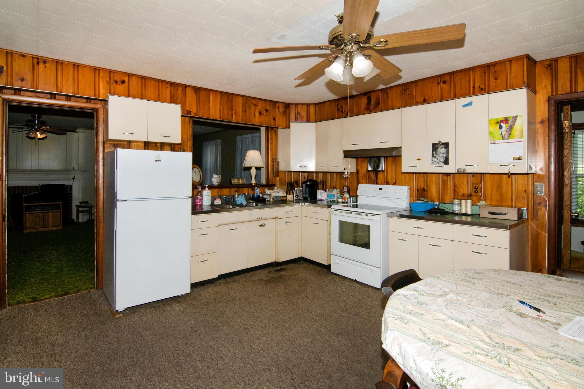 266 Passaic Avenue Thorofare, NJ 08086 - Photo 10 of 53 a kitchen with white cabinets and white appliances