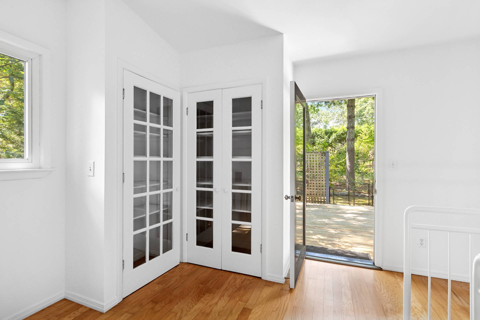 803 Noyack Road Southampton, NY 11968 - Photo 13 of 20 a view of an entryway with wooden floor and door