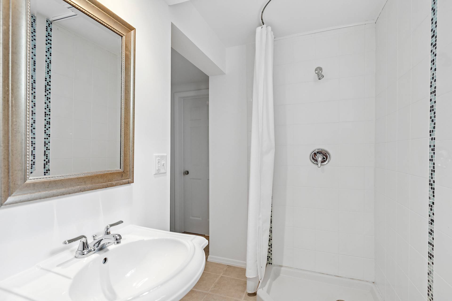 803 Noyack Road Southampton, NY 11968 - Photo 15 of 20 a bathroom with a sink a mirror and a shower