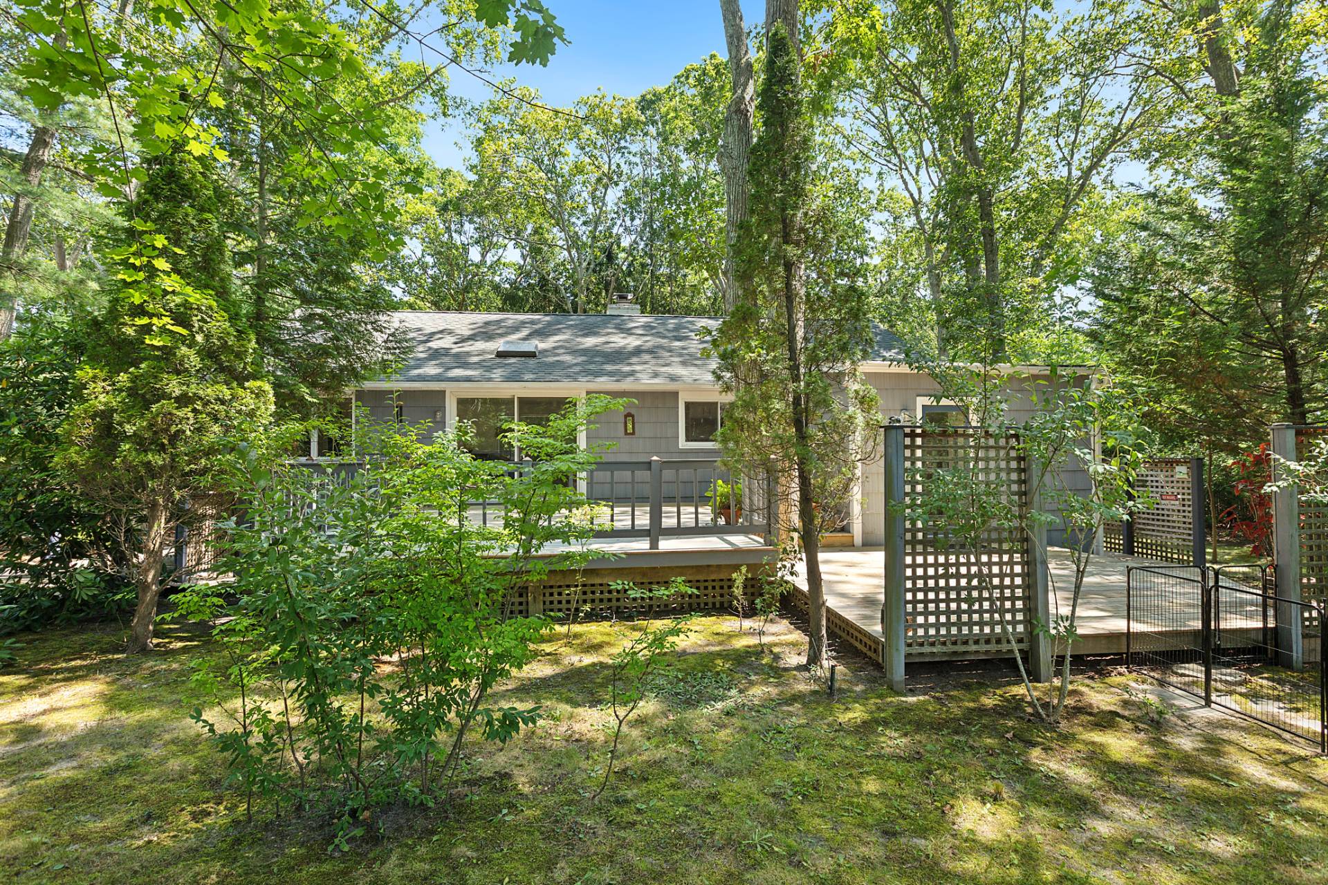 803 Noyack Road Southampton, NY 11968 - Photo 2 of 20 a view of a house with a yard