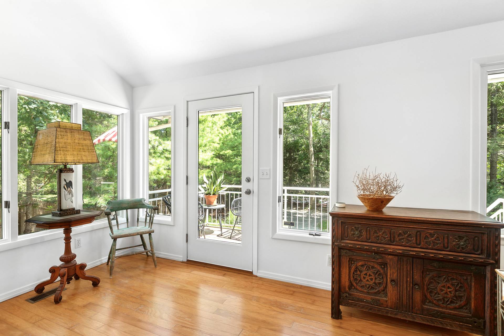 803 Noyack Road Southampton, NY 11968 - Photo 4 of 20 a living room with furniture and a floor to ceiling window