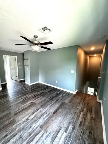 a view of a livingroom with wooden floor