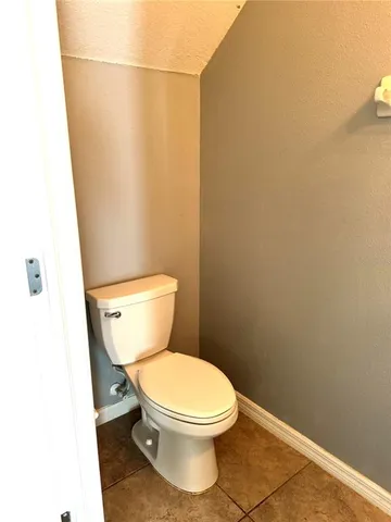 a spacious bathroom with a mirror a shower and a sink