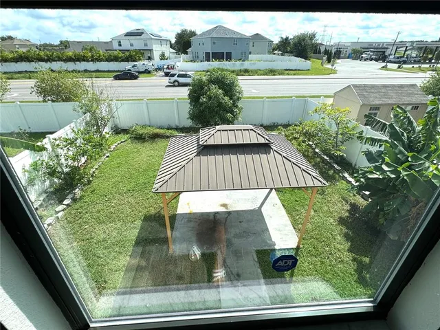 a view of an chair and table in the garden