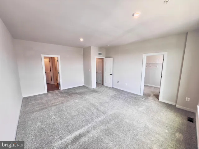 a bathroom with a shower and a mirror