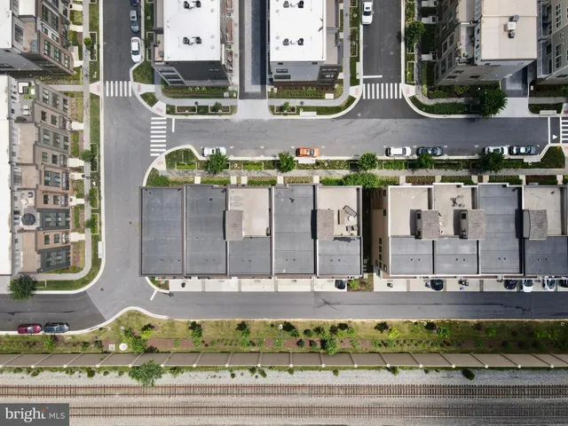 a view of a patio with couches and potted plants