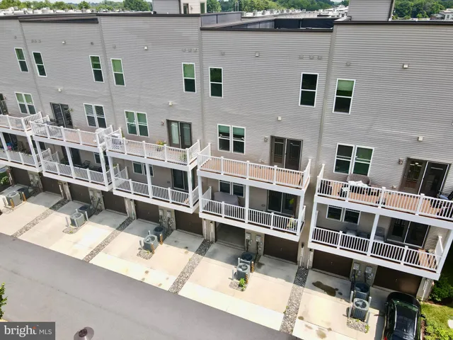a view of residential houses with outdoor space