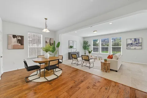a view of an entryway with wooden floor and door