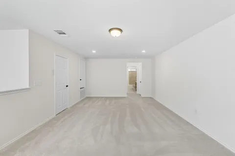 a view of a house next to a yard with large trees