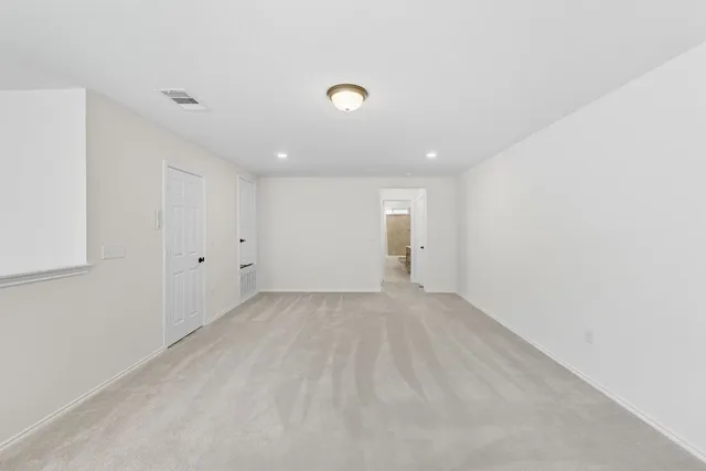 a view of a house next to a yard with large trees