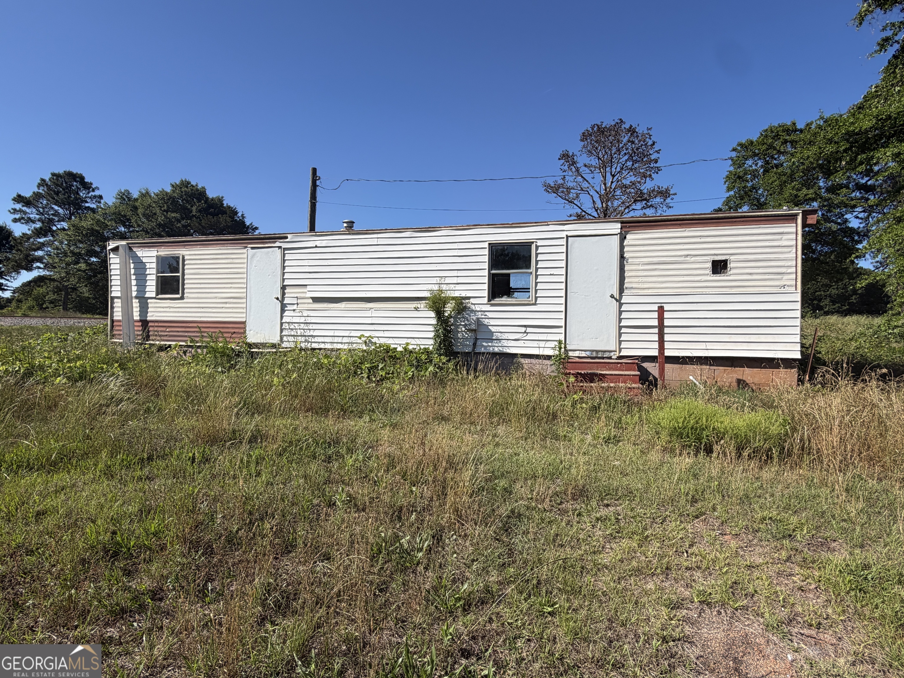 265 Aldora Street Barnesville, GA 30204 - Photo 2 of 9 a view of a house with a yard