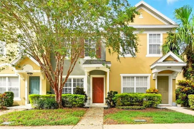 front view of a house with a garden