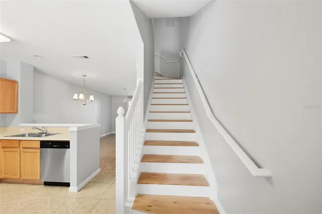 a view of entryway and kitchen