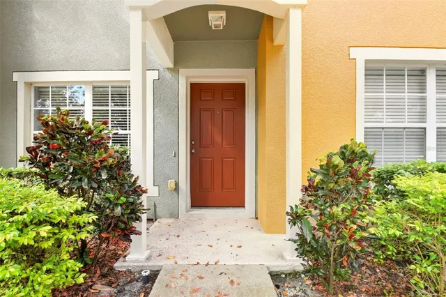 front view of a house with a potted plant
