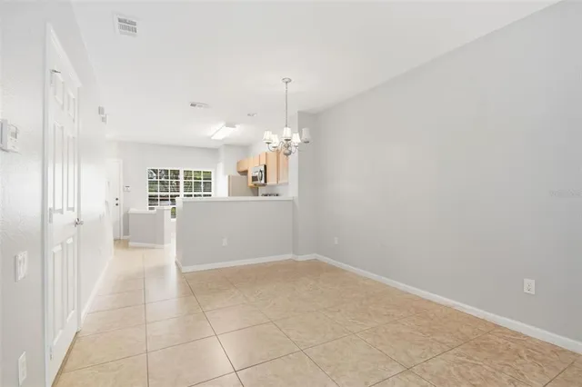 an empty room with windows and entrance