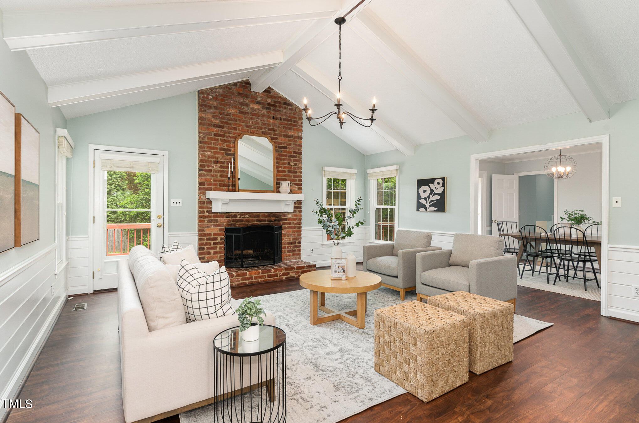 4100 Stranaver Place Raleigh, NC 27612 - Photo 1 of 43 a living room with furniture a fireplace and a chandelier