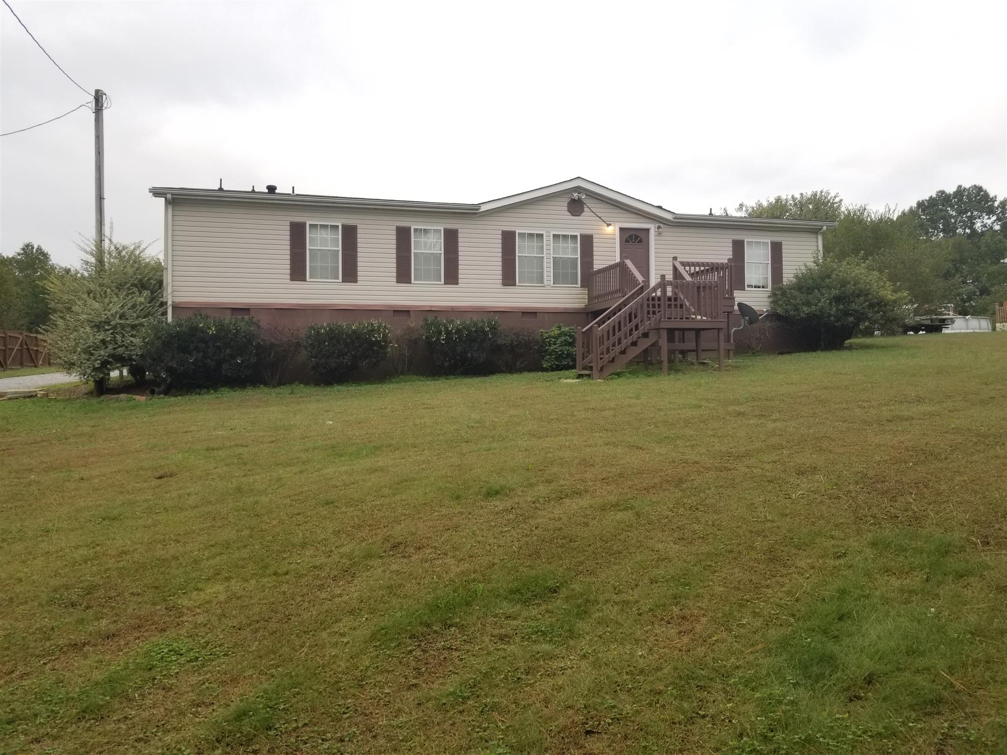 230 Hester Road Portland, TN 37148 - Photo 3 of 4 a view of a house with a garden and yard