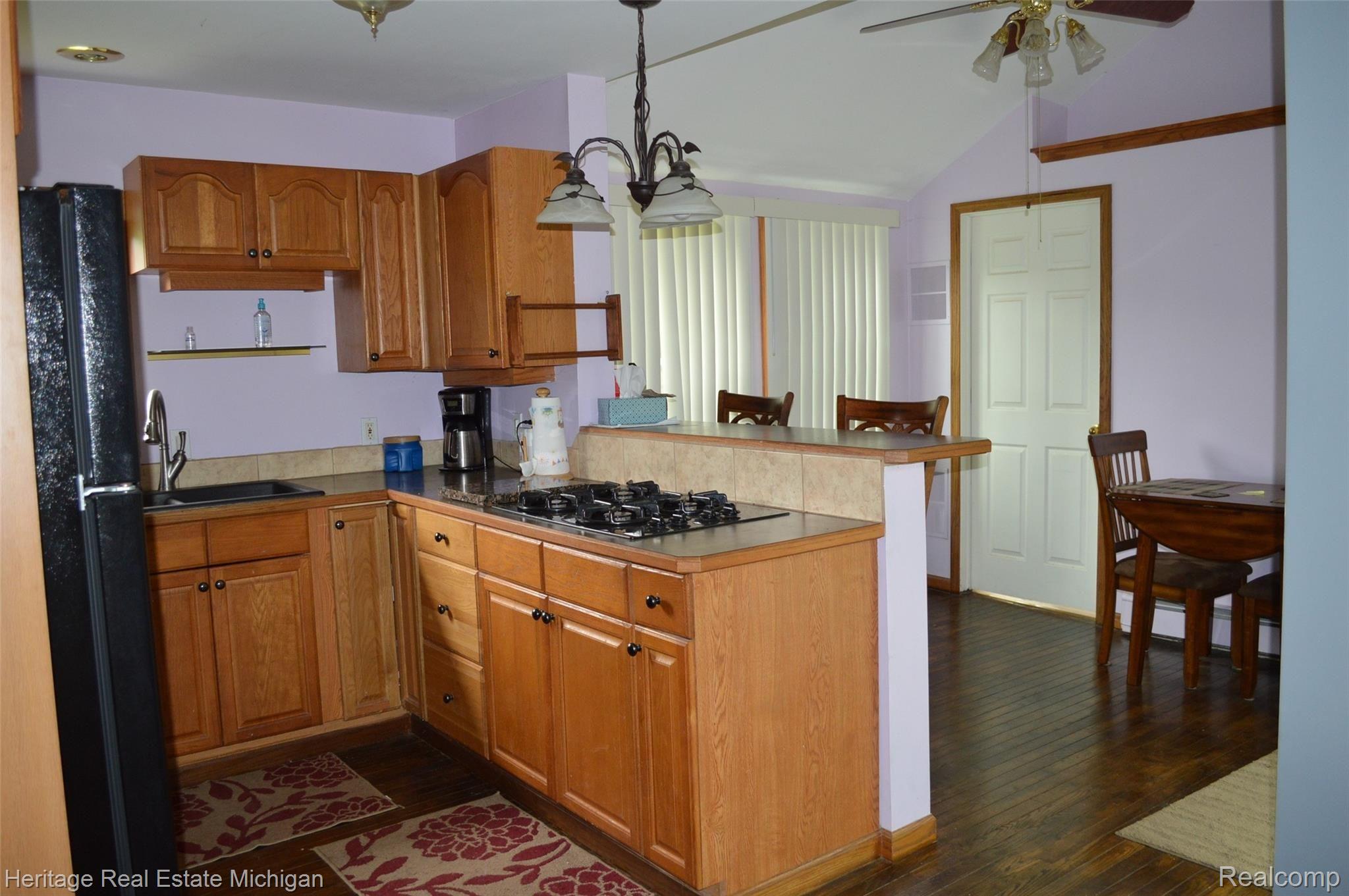 9423 Roland Brighton, MI 48116 - Photo 14 of 23 Kitchen and dining area