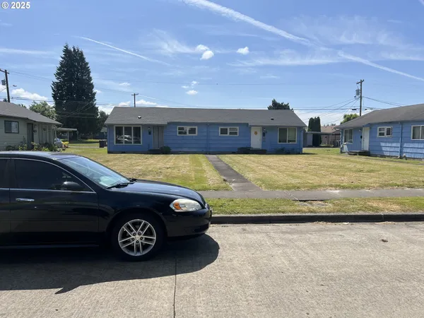 a car parked in front of a house