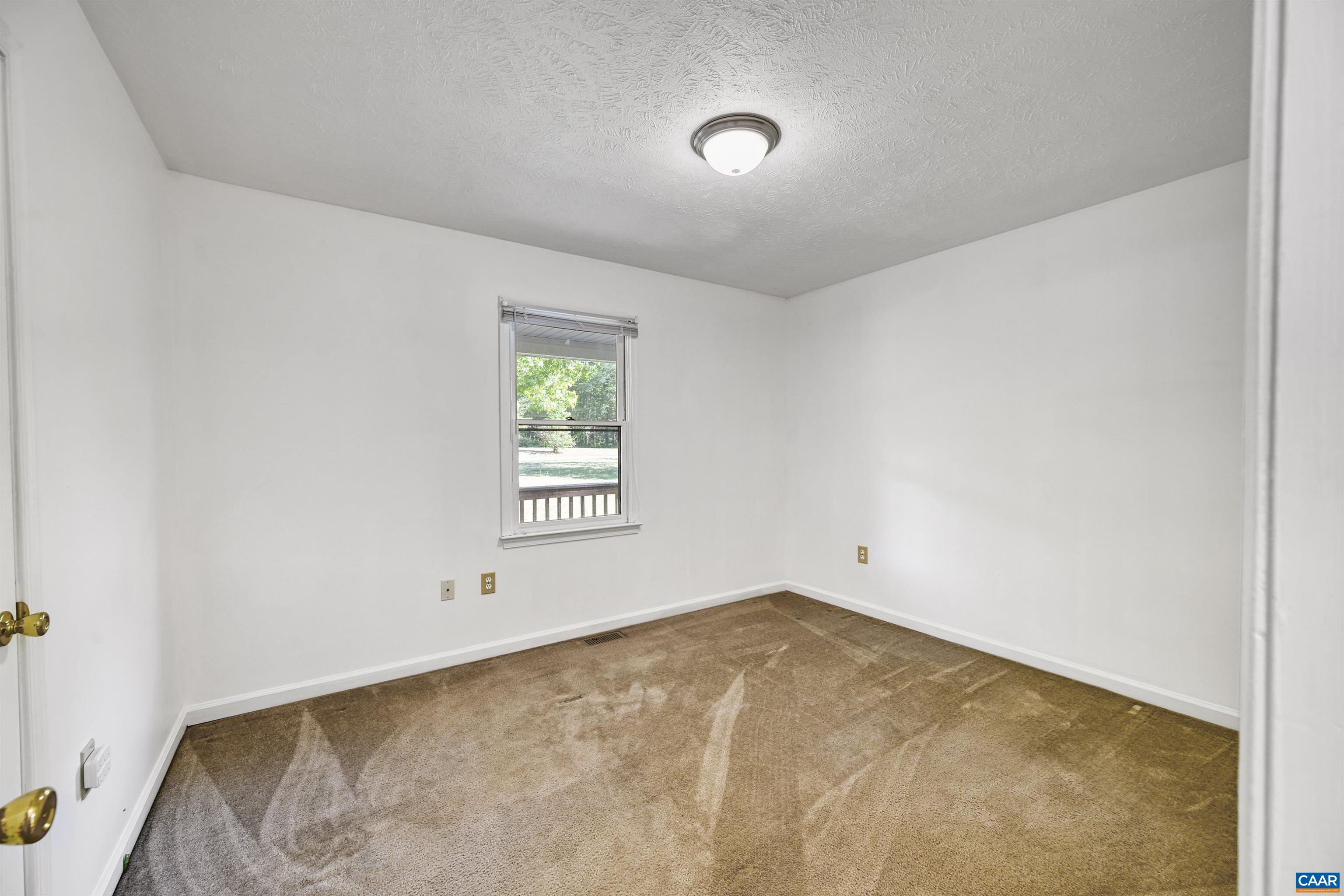2445 Eastham Road Bumpass, VA 23024 - Photo 19 of 29 an empty room with a window