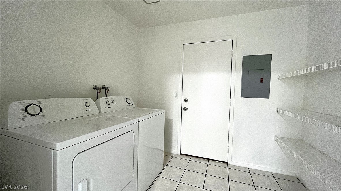 6750 Del Rey Avenue, Unit 123 Las Vegas, NV 89146 - Photo 8 of 21 A well-appointed laundry room features tile flooring and convenient wire shelving.