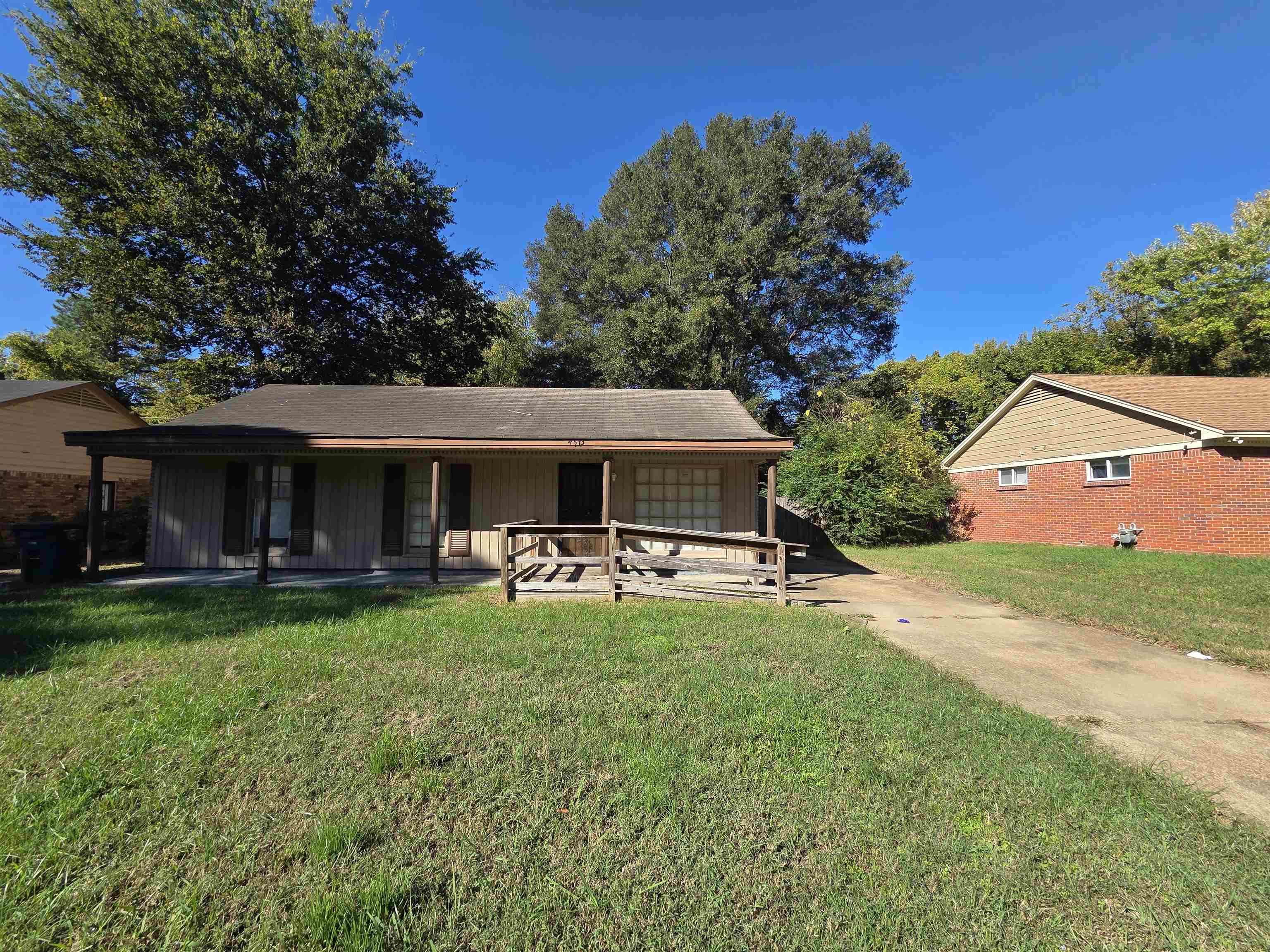 4573 Appleville Street Memphis, TN 38109 - Photo 2 of 22 View of front of home with a front yard, a porch, and concrete driveway