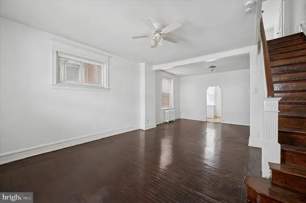 a view of an entryway with wooden floor