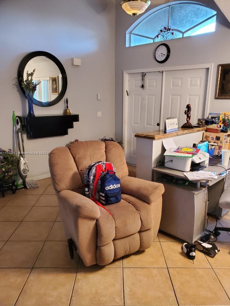 Davie Davie, FL 33325 - Photo 2 of 13 a living room with furniture a air conditioner and a table