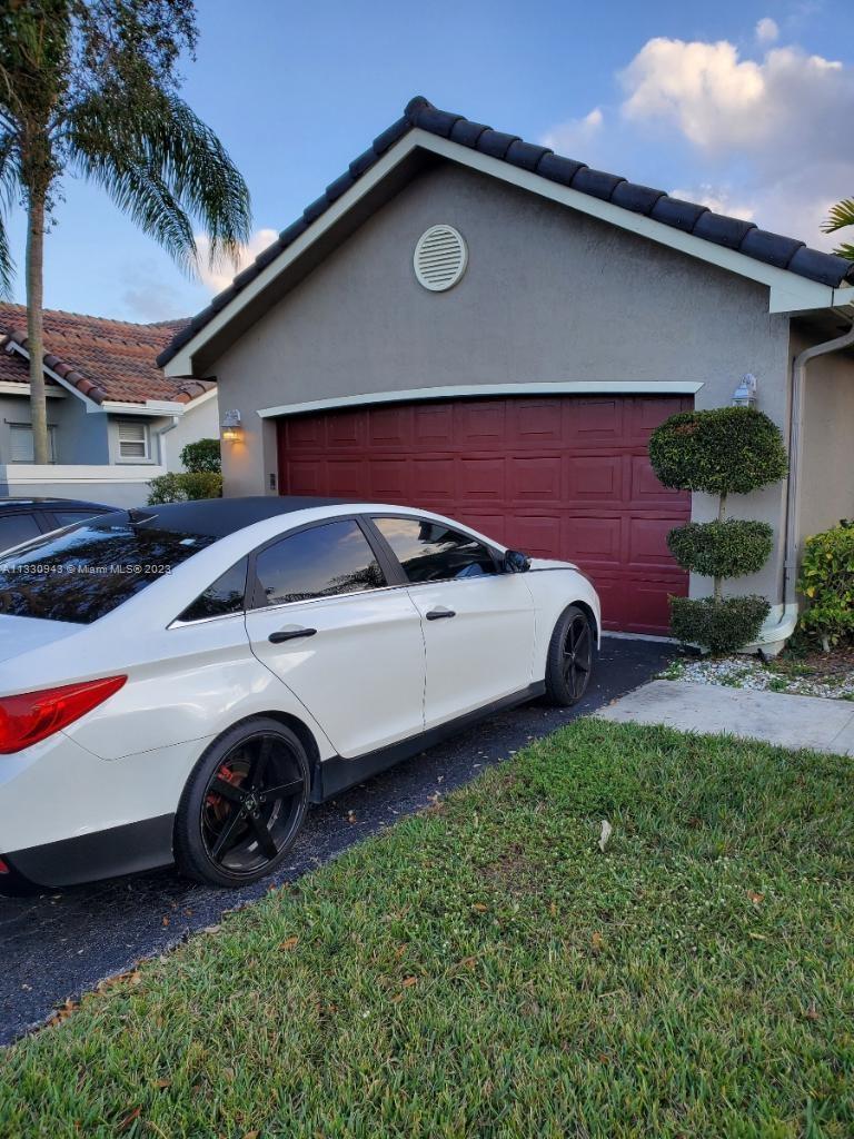 Davie Davie, FL 33325 - Photo 9 of 13 a view of a car parked in front of a house