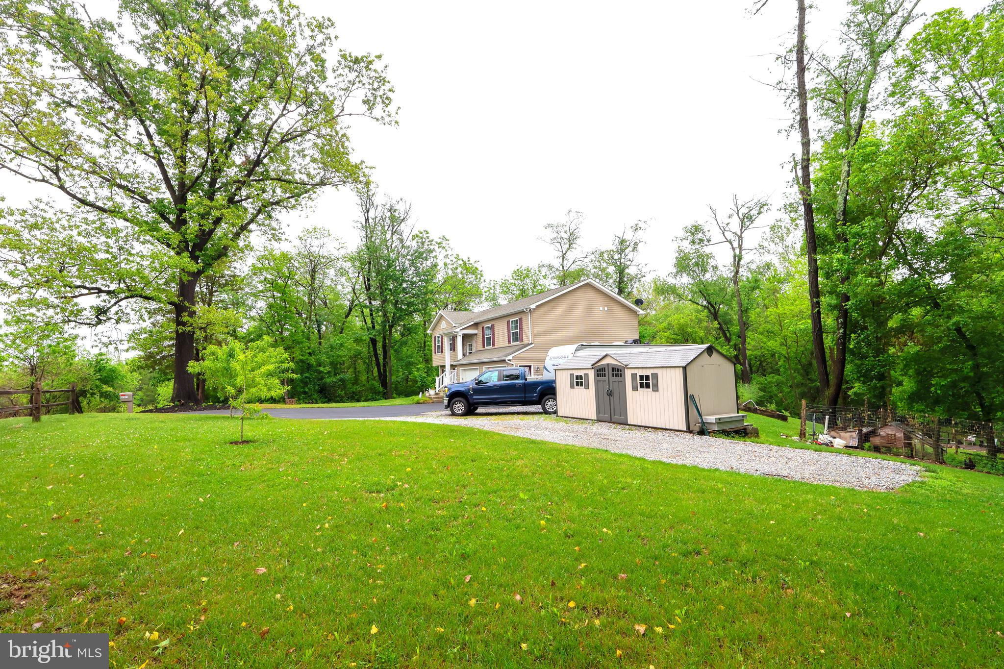 16919 Shaffer Road Sharpsburg, MD 21782 - Photo 54 of 58 a white house with a big yard and large trees