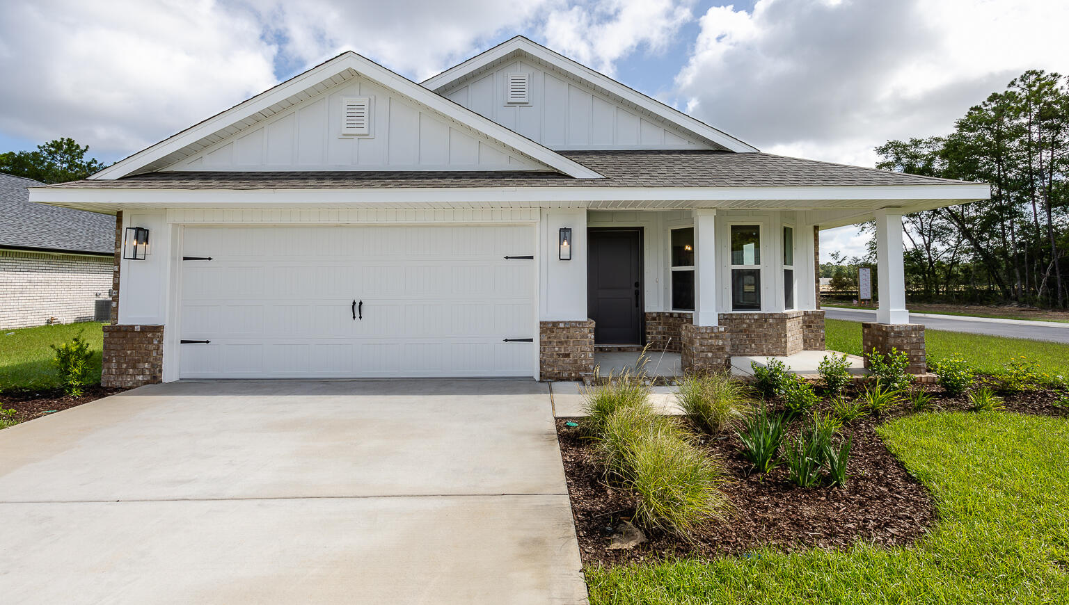 5303 Zenith Lane Milton, FL 32583 - Photo 11 of 21 a front view of a house with garden