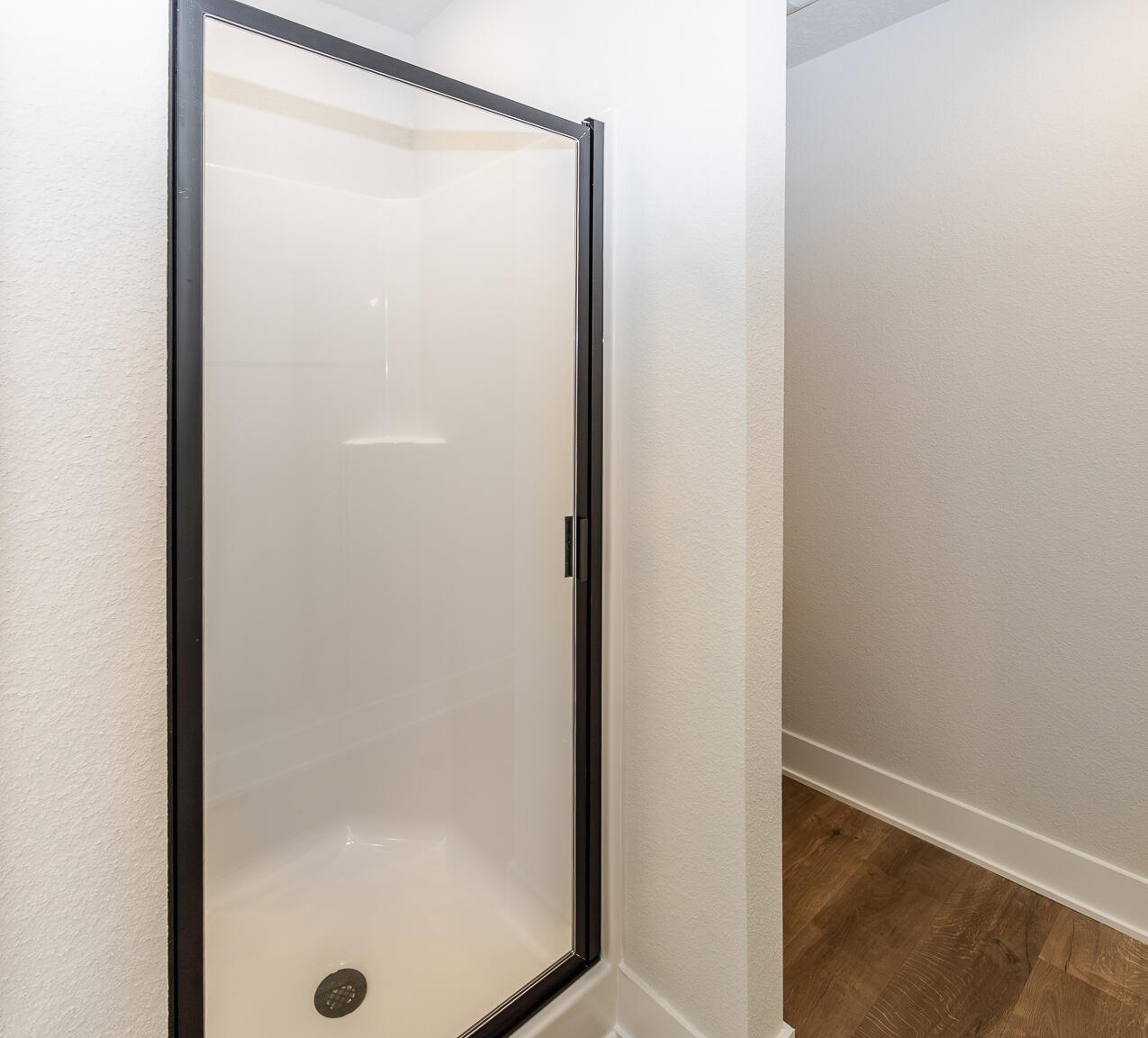 5303 Zenith Lane Milton, FL 32583 - Photo 14 of 21 a bathroom with a glass shower door