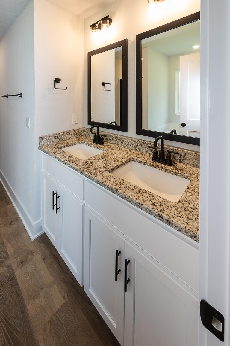 5303 Zenith Lane Milton, FL 32583 - Photo 15 of 21 a bathroom with a granite countertop sink and a mirror