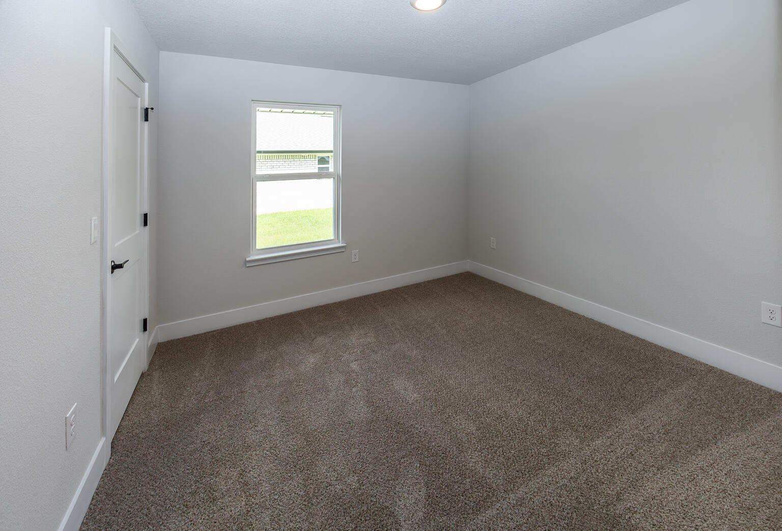 5303 Zenith Lane Milton, FL 32583 - Photo 18 of 21 an empty room with a window