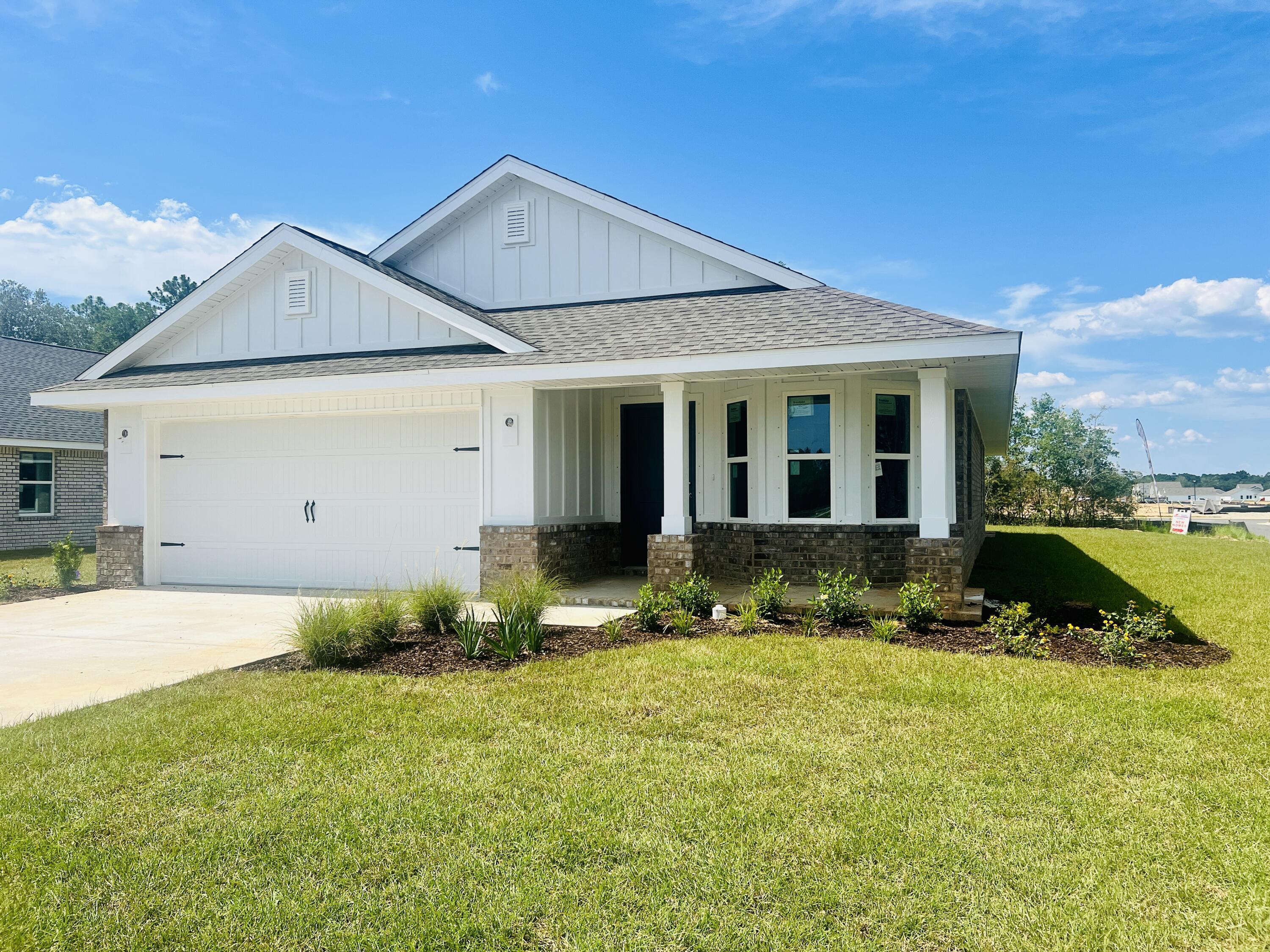 5303 Zenith Lane Milton, FL 32583 - Photo 2 of 21 a view of a house with a yard