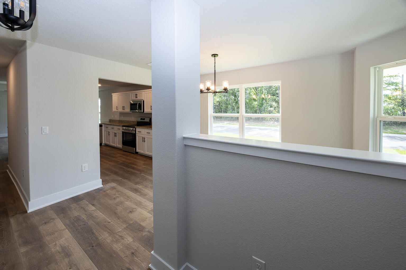 5303 Zenith Lane Milton, FL 32583 - Photo 8 of 21 a view of a kitchen from the hallway